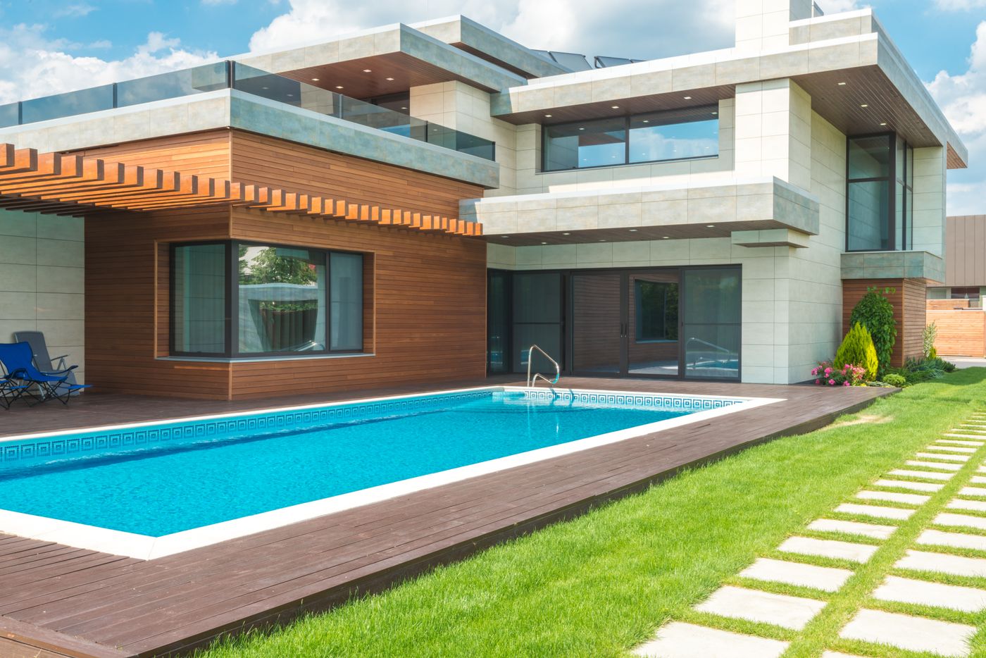 Custom backyard pool beside a modern home